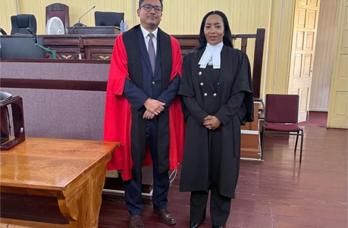 Attorney-at-Law Zola Williams alongside Justice Gino Persaud