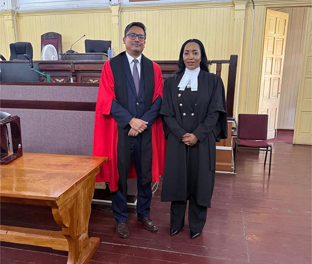 Attorney-at-Law Zola Williams alongside Justice Gino Persaud