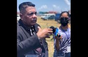 Agriculture Minister, Zulfikar Mustapha, speaking with reporters during a recent flood-relief distribution at Bush Lot, West Coast Berbice