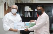 Agriculture Minister, Zulfikar Mustapha (right) exchanges an investment document with Mr. Aluizio Nascimento da Silva