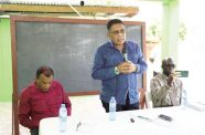 Minister of Agriculture, Zulfikar Mustapha addressing residents of Uitvlugt in the company of Director-General of the Ministry, Madanlall Ramraj, and CEO of GLDA, Dr Dwight Walrond. 