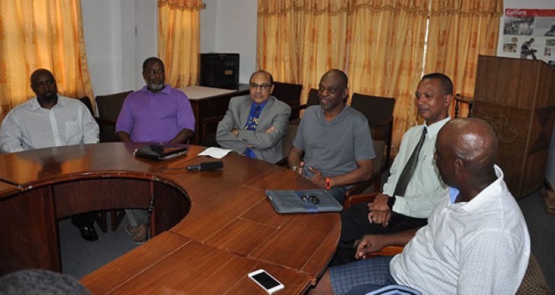 National record holder, James Wren-Gilkes (fourth from left), with GOA president, K. A. Juman-Yassin (third from left), AAG president, Aubrey Hutson (fifth from left) and others
