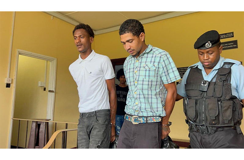 Murder accused Colwin Morris (left) and Peter Baker following their court appearance on Friday