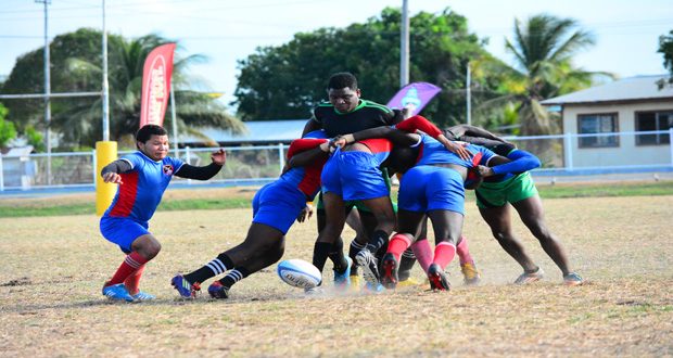 This Samuel Maughn Photo shows a scrum battle between Police Sports Club and UG Wolves in the Banks Beer Rugby Sevens.