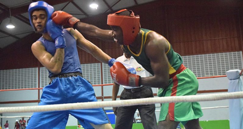 Part of the action between Guyana Defence Force and Republican on Saturday evening at the National Gymnasium (Cullen Bess-Nelson photo).