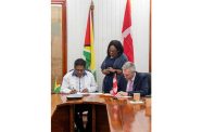 Dr. Ashni Singh, Senior Minister in the Office of the President with Responsibility for Finance and the Public Service, and Mr. Boris Jacouty, Director, Business Development and Infrastructure, at the Canadian Commercial Corporation, sign the renewed Memorandum of Understanding (MoU)
