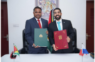 The Minister of Public Utilities and Aviation, Deodat Indar (left) and Captain Rafael Bárcenas Chiari, Director General of the Civil Aviation Authority at the signing ceremony (GCAA photo)