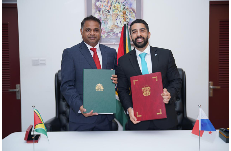 The Minister of Public Utilities and Aviation, Deodat Indar (left) and Captain Rafael Bárcenas Chiari, Director General of the Civil Aviation Authority at the signing ceremony (GCAA photo)