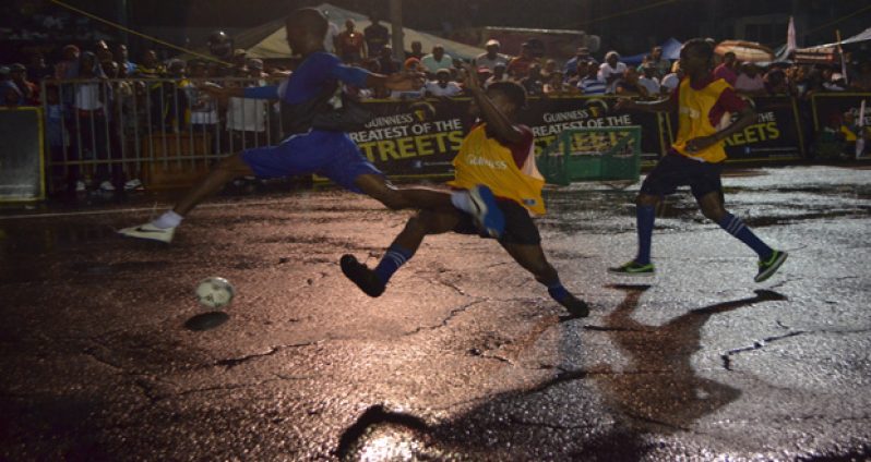 Travis Grant goes airborne during a challenge from a Back Circle player in their third- place showdown of the Georgetown leg Guinness Greatest In Da Street.