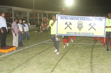 There was a march past of the teams taking part in the GFA Banks Beer Cup tournament on Friday night. In this Sonell Nelson photo, Minister of Sport Dr. Frank Anthony is seen taking the salute as the Alpha United team goes past.
