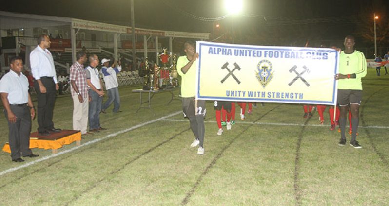 There was a march past of the teams taking part in the GFA Banks Beer Cup tournament on Friday night. In this Sonell Nelson photo, Minister of Sport Dr. Frank Anthony is seen taking the salute as the Alpha United team goes past.