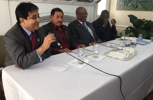Ambassador Riyad Insanally introduces Minister Sydney Allicock, Minister Winston Jordan and Minister David Patterson to the audience (FQ Farrier photo)