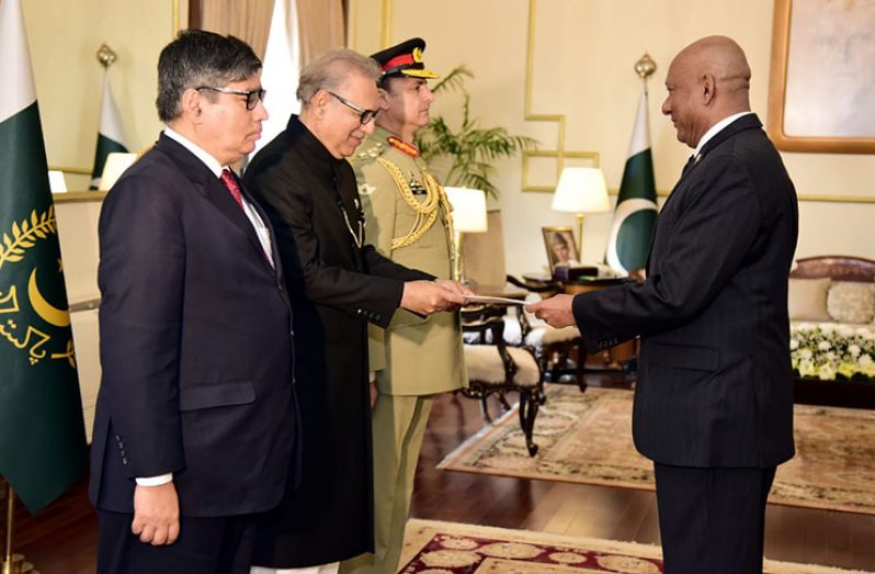 Ambassador to the People’s Republic of China, His Excellency Bayney Karran (right) presents his Letters of Commission to President of the Islamic Republic of Pakistan, His Excellency Dr. Asif Alvi.