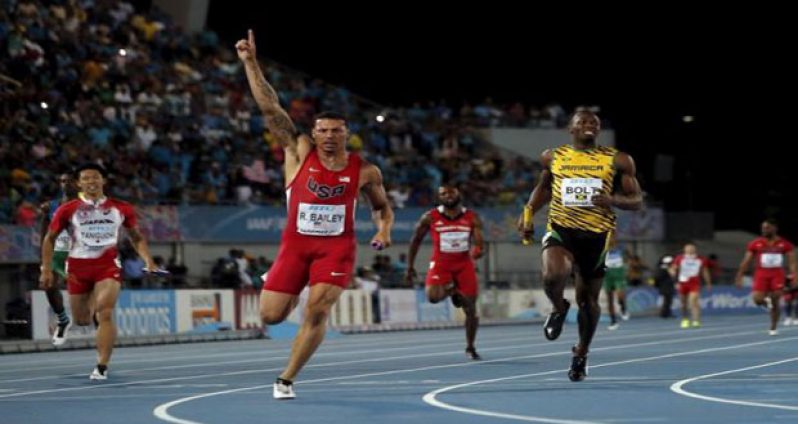 .Ryan Bailey of the U.S. (C) celebrates as he crosses the finish line ahead of Jamaica's Usain Bolt (L) as the U.S. won the 4x100 metres race at the IAAF World Relays Championships in Nassau, Bahamas, Saturday. Japan's Kataro Taniguchi is at left. (Reuters/Mike Segar)