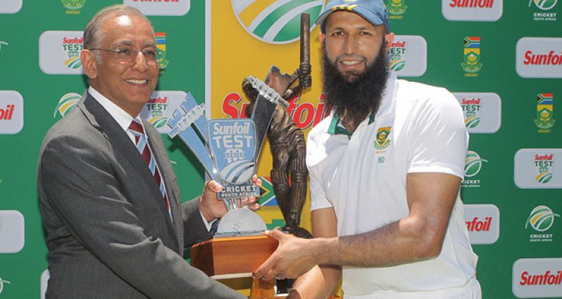 SA captain Hashim Amla receives the Sir Vivian Richards trophy from Haroon Lorgat during day 5 of the 3rd Test between South Africa and West Indies at Sahara Park Newlands, yesterday.