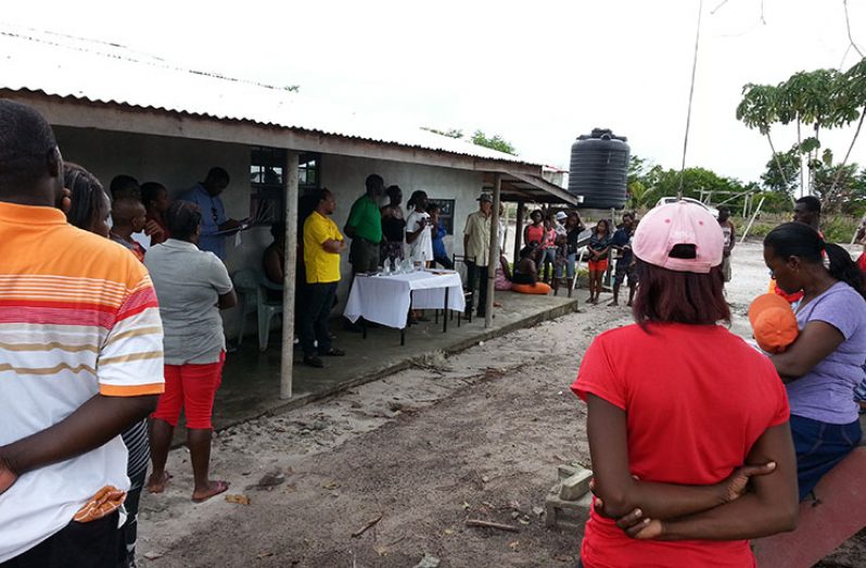 Commissioner of the Guyana Lands and Surveys Commission meets with residents of Andyville