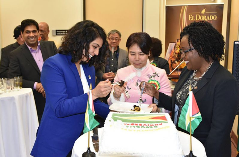 Consul-General Anyin Choo (centre) enjoys the anniversary cake with MPP Sara Singh (left) and Dean of the Consular Corps of Toronto Ann-Marie Layne