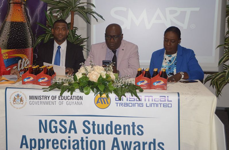 At the head table at the handing over ceremony was (from left) Ansa McAl Brand Manager, Errol Nelson; Chief Education Officer, Dr. Marcel Hutson; and Minister of Education, Dr. Nicollette Henry (Adrian Narine photo)