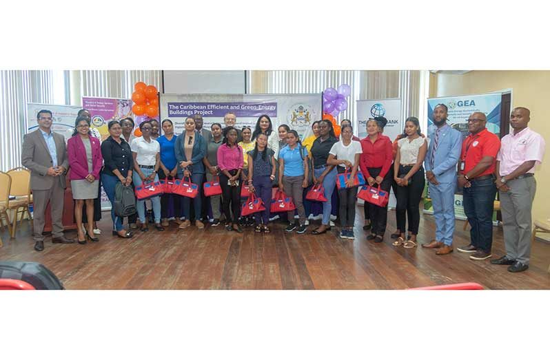 Minister of Human Services and Social Security, Dr. Vindhya Persaud; CEO of BIT, Richard Maughn; Political Counsellor at the Canadian High Commission, Daniel Bood, surrounded by participants of the Female Apprenticeship Programme and other stakeholders. (Japheth Savory photo)