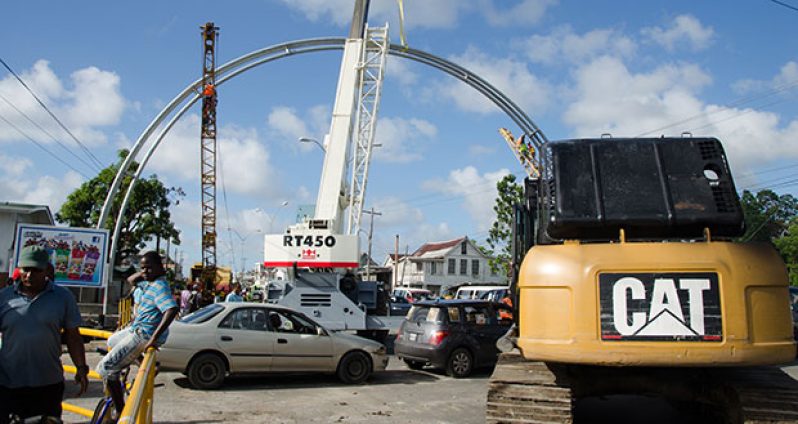 The Agricola Independence Arch being placed into position on Sunday (Delano Williams photo)