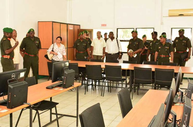 Brigadier Patrick West and UG Vice Chancellor Ivelaw Griffith during discussion with other officials