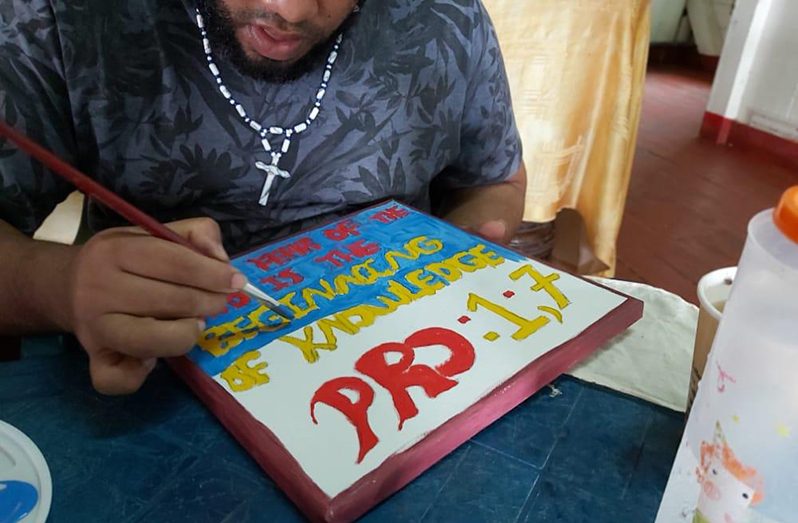 A prisoner putting his painting skills to the test