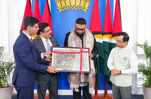 President Dr. Irfaan Ali receiving several pieces of art from the Bihar Museum, a state-owned institution in Patna, India. The pieces were presented by the High Commissioner of India to Guyana, Dr. Amit Telang; the Deputy Director of the Museum, Dr. Sunil Kumar Jha, and the Museum’s Curator, Dr Ravi Gupta, during a courtesy visit on Wednesday. The pieces feature a replica of a terracotta figurine of a smiling girl from the 3rd century BC; a framed photo of a Mithila (Madhubani) painting— a traditional Indian art form originating in the Mithila region of Bihar and Nepal; a silk shawl with a Madhubani design; and a jute flower bouquet made by craftsmen from Bihar (Photos: President Ali/Facebook)