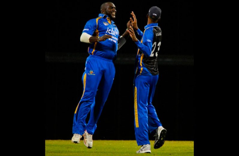 Leading wicket-taker Ashley Nurse (left), pictured here celebrating with Roston Chase, will be a key player for Pride in the semi-finals. (Photo courtesy WICB Media)