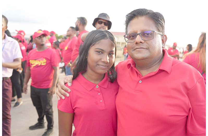 Senior Minister in the Office of the President with Responsibility for Finance and the Public Service, Dr. Ashni Singh, with a young supporter at the Black Bush Polder meeting (Photo: Ashni Singh/Facebook)