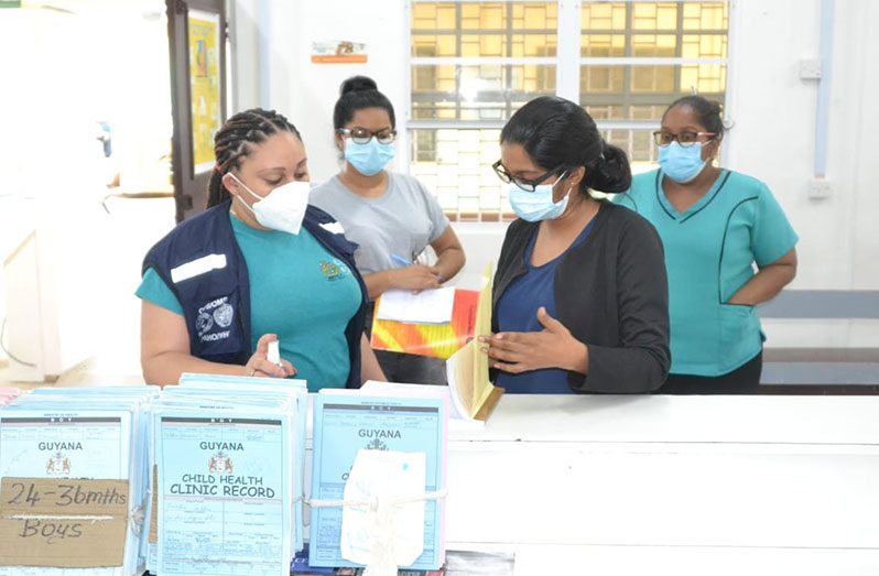 CDEMA officials with health workers in Region Two