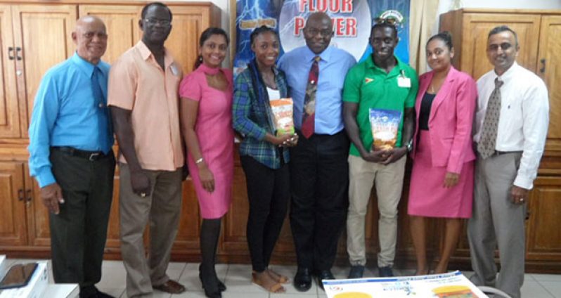 NAMILCO's Public Relations Consultant Hafeez Khan (left), co-Chairman of the meet Colin Boyce (second from left),  Alita Moore (third from left), NAMILCO's Finance Controller Fitzroy McLeod (centre), Winston George (third from right) and Assistant to the Managing Director Autamaram Lakeram along with two company representatives  at the presentation ceremony.