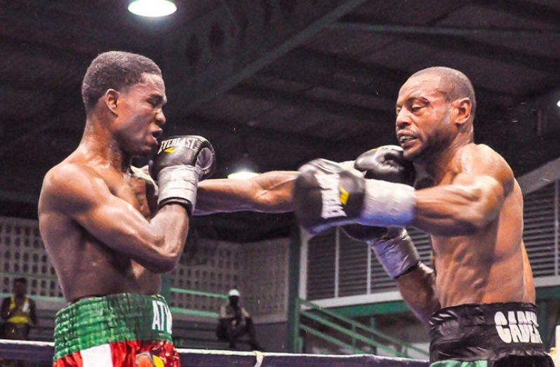 Clive Atwell, left, throwing left jab during a bout