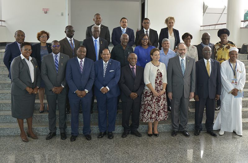 Prime Minister Moses Nagamootoo and Foreign Affairs Minister, Carl Greenidge (fourth and fifth left respectively) with delegates and other local officials, including ministers of government, at the ICAO conference. Standing immediately right of Minister Nagamootoo is ICAO Council President, Dr. Olumuyiwa Benard Aliu