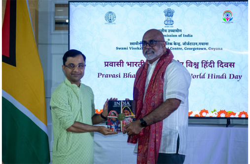 Neaz Mohamed Subhan, NCN's CEO collects his award from Indian High Commissioner to Guyana, Dr. Amit Telang (NCN Guyana photos)