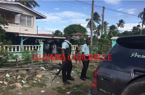 Police outside the home of Nirmala Devi Persaud after the robbery