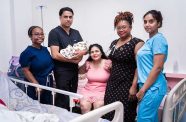 Melinda Singh (seated) with members of the specialised team that ensured she delivered a healthy baby boy (GPHC photo)