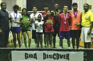 GOA’s Hector Edwards and Charles Corbin pose with the Discover Open badminton winners.