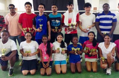 Winners of the Woodpecker Badminton Tournament pose with their prize, third from right in th front row is Priyanna Ramdhani
