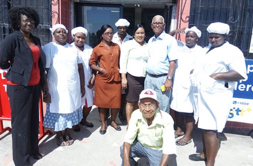Mr Steve Bovell and (centre) and some of his staff standing in front of the bakery