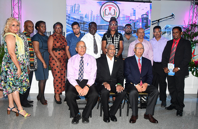 President David Granger (sitting centre) with Banks DIH Chairman, Clifford Reis (sitting right) and Human Resources Director, Andrew Carter (sitting left) with representatives from the awarded education institutions (Adrian Narine photo)