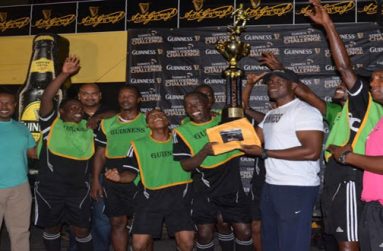Flashback! Lee Baptiste (right), Banks DIH Guinness Brand Manager, hands over the winners’ purse of $500 000 and the championship trophy to captain of the victorious North Ruimveldt unit Joshua Browne, following his team’s dominance in the sixth annual Georgetown Guinness ‘Greatest of De Streets’ tournament.