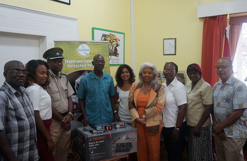 Pictured are members of the Prison Fellowship Association and the Friends of Guyana, along with Consul General Ms. Cita Pilgrim and Dr. Nick Harewood, with the equipment and tools in the center.