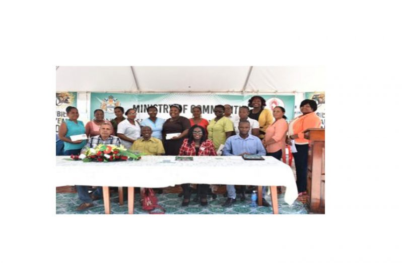 Head Table from Left-Gordon Bradford Regional Chairman of Bartica, Hamilton Green, Chairman CH&PA Board, Hon.Valerie Adams-Patterson Minister within the Ministry (Housing) and Gifford Marshall Mayor of Bartica with the recipients of the CH&PA home improvement subsidy.
