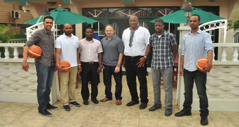Some of the Bermuda national players along with head coach Darcel Harris, (second from left), GABF vice-president Michael Singh and GABF president Nigel Hinds.