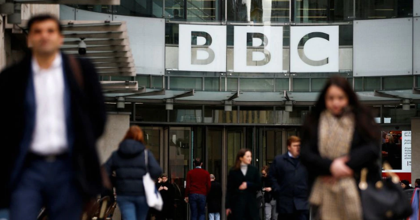 Pedestrians walk past a BBC logo at Broadcasting House in London, Britain, January 29, 2020. REUTERS/Henry Nicholls/File Photo