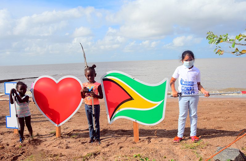 Some of the young volunteers of the ‘Seawalls and Beyond’ group gathered at the launching of the NDIA’s ‘No Littering Campaign’ on Tuesday at the Georgetown seawalls (Photo by Adrian Narine)
