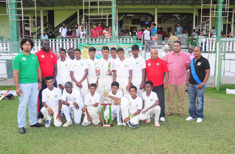 The victorious Berbice team with GCB officials and representative of Dave West Indian Imports, Cliff Joseph,after their 5-wicket victory.