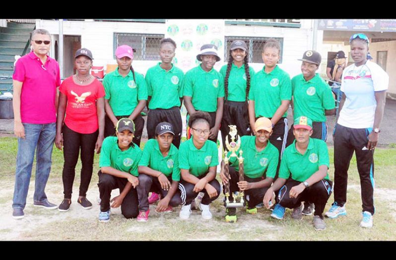 The victorious Berbice team pose with Secretary of the Guyana Cricket Board (GCB), Anand Sanasie (standing far left).