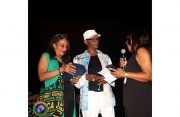 Vice-president of the JMCC, Christine Marzouca (left) and President, Dr Apollone Reid, make a presentation to music legend, Beres Hammond