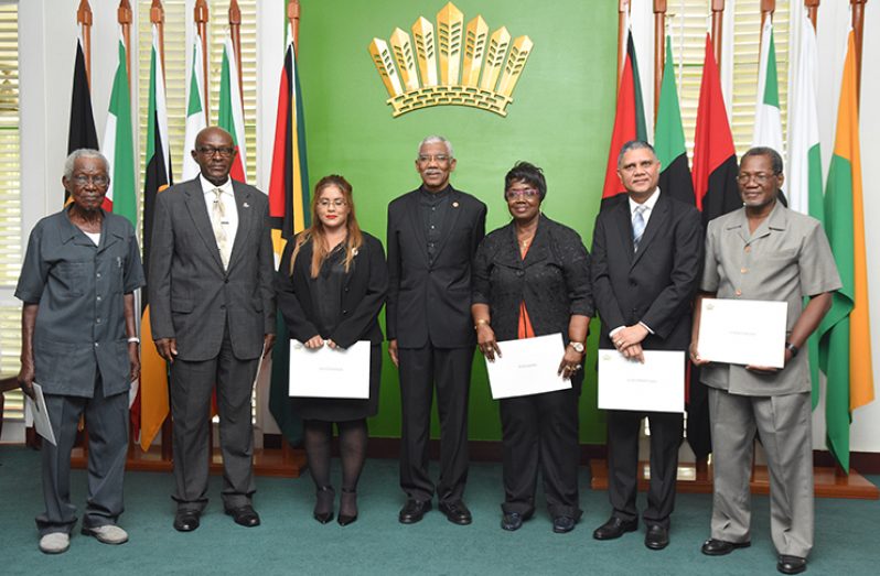 President David Granger with members of the newly sworn in members of the Public Service Commission (Samuel Maughn photo)
